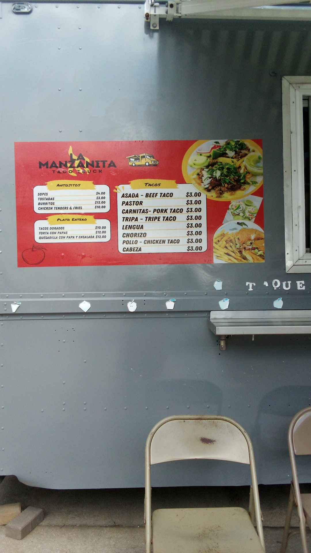 Our menu board on the side of the taco truck